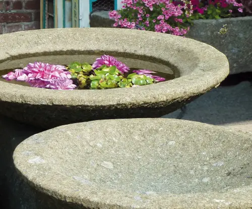 Product image of the product “Bowl model „Lotus“, bossed outer surface, 125x125x40 cm  Natural stone (Basanit), ”