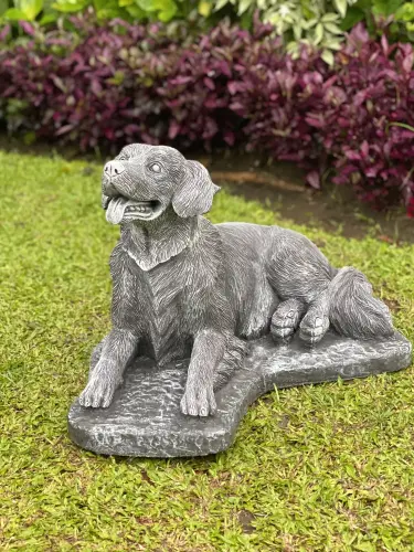 Product image of the product “Cooper - Golden Retriver, lying on base 68cm L | cast stone ”