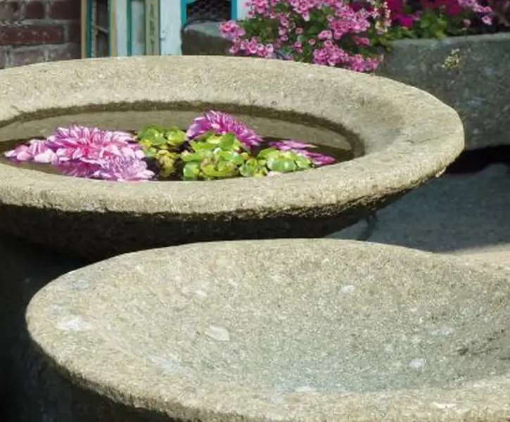 Product image 1 of the product “Bowl model „Lotus“, bossed outer surface, 100x100x30 cm  Natural stone (Basanit), ”