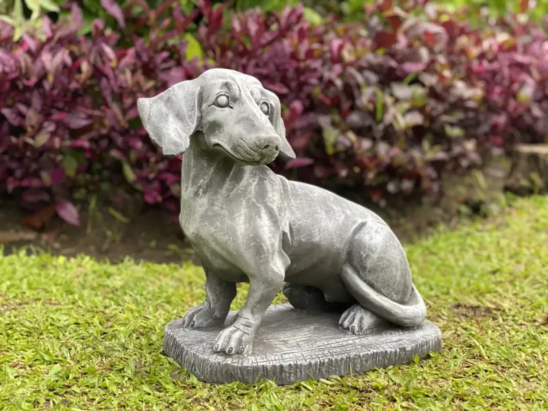 Product image 1 of the product “Timber - Dachshund sitting on a pedestal, 37 cm L | cast stone ”