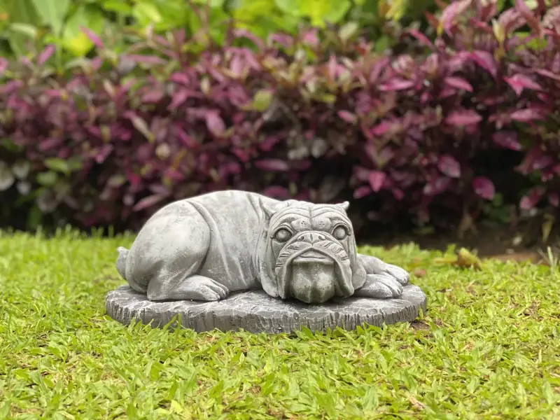 Product image of the product “Spike -Small bulldog lying on Base, 38cm L | cast stone ”