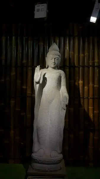 Product image of the product “Standing Buddha with floral carving, Abudaya position. 43 x 39 x 175cm. Natural stone (river stone), stonemasonry ”