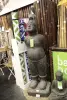 Product image 4 of the product “Corean inspired statue.Standing Boy. 47 x 40 x 148cm. Stone cast, handcrafted & coloured ”